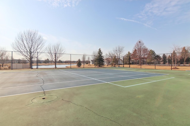 view of sport court featuring fence