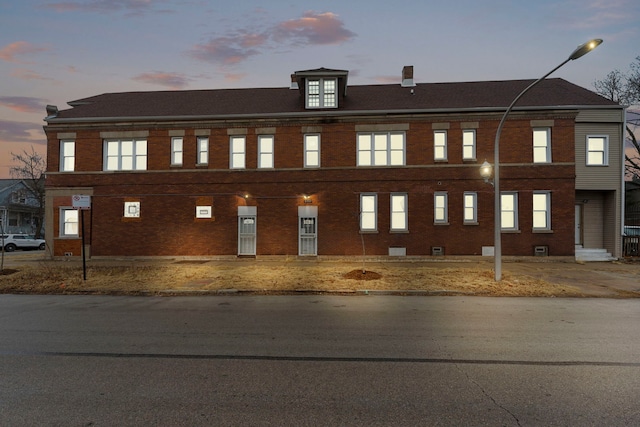 view of front of home with brick siding