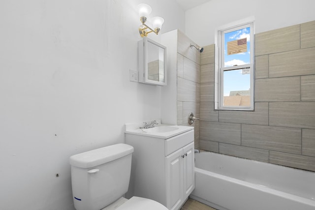 bathroom with vanity, bathtub / shower combination, and toilet