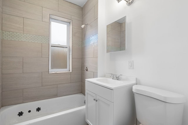 bathroom featuring bathtub / shower combination, vanity, and toilet