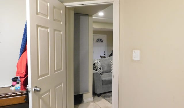 hallway with light tile patterned floors