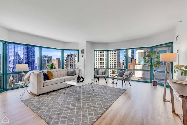 living room with a city view and wood finished floors