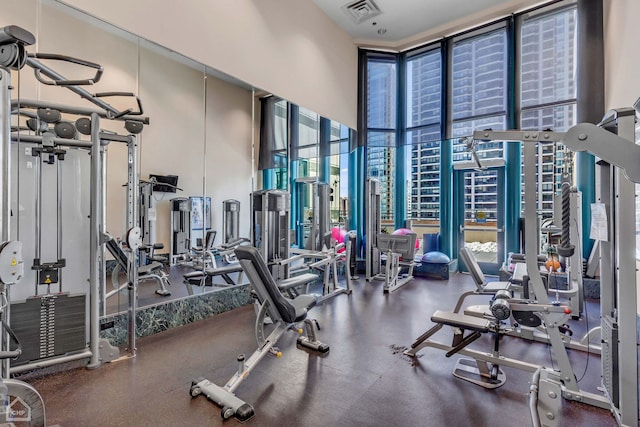 gym featuring a wall of windows and visible vents