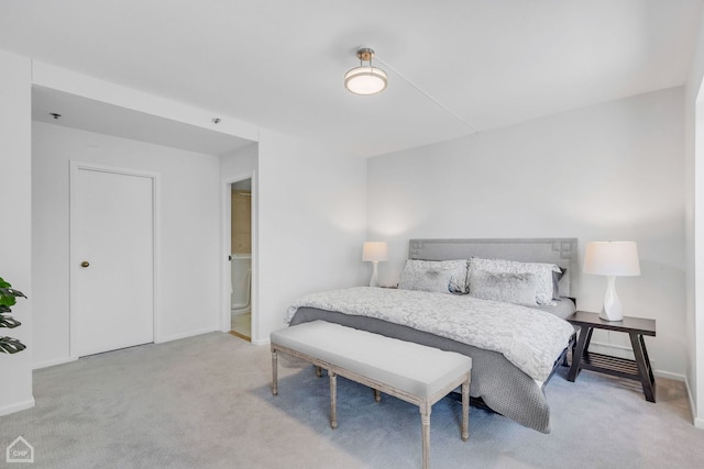 bedroom featuring carpet flooring and baseboards