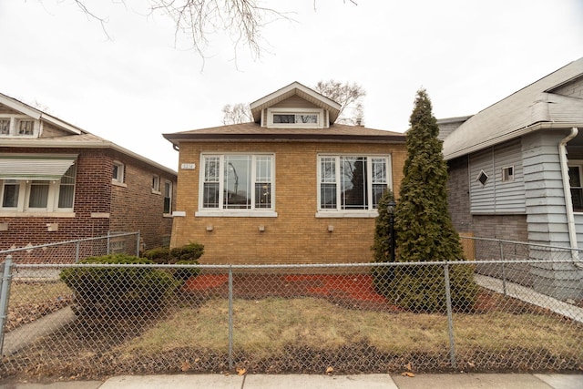 view of property exterior with fence private yard and brick siding