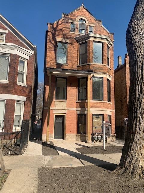 view of front of home featuring brick siding
