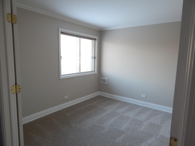 unfurnished room featuring crown molding, visible vents, baseboards, and dark carpet