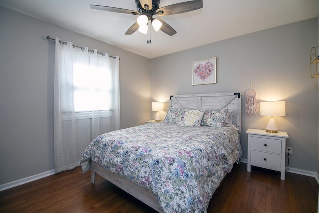 bedroom with wood finished floors, a ceiling fan, and baseboards