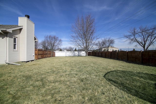 view of yard with a fenced backyard