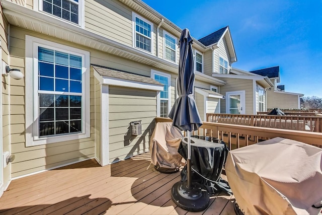 wooden terrace featuring area for grilling