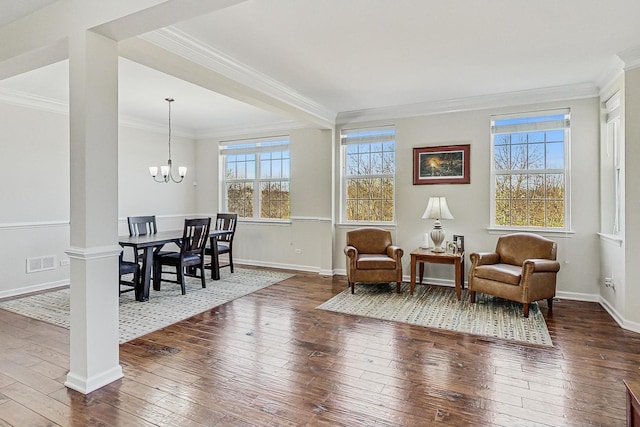 sitting room featuring visible vents, crown molding, and hardwood / wood-style flooring