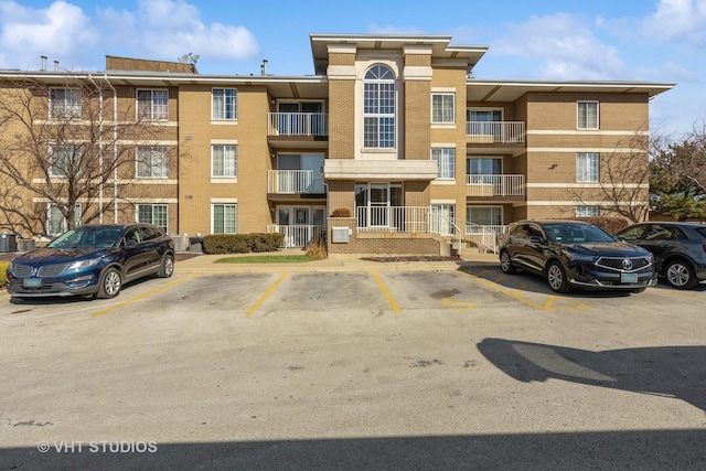 view of property with uncovered parking