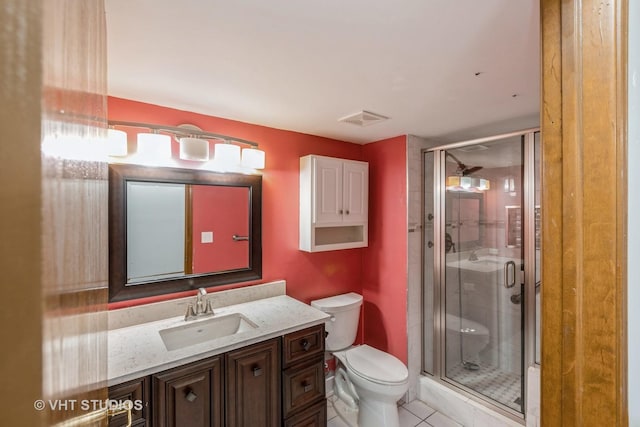 bathroom featuring a shower stall, visible vents, vanity, and toilet