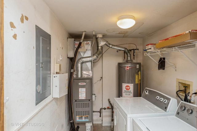 clothes washing area with washing machine and dryer, laundry area, water heater, and electric panel