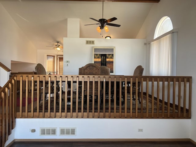 interior space with ceiling fan and visible vents