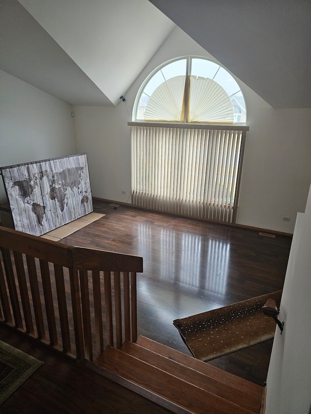 interior space featuring lofted ceiling and wood finished floors