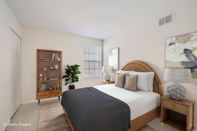 bedroom with carpet floors and visible vents