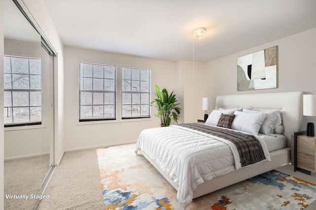 bedroom with multiple windows and baseboards