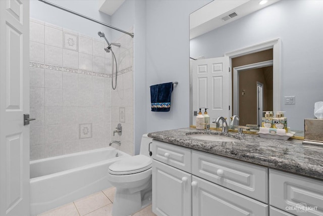 full bath with visible vents, toilet, vanity,  shower combination, and tile patterned flooring