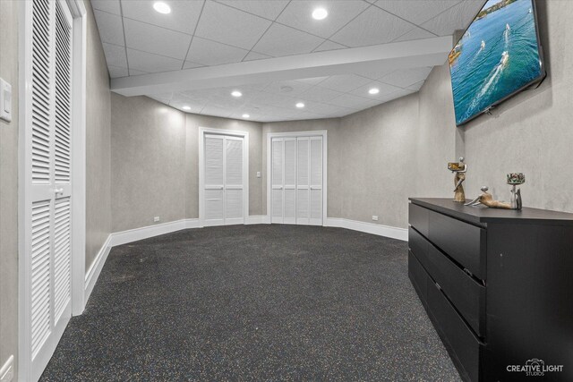 interior space featuring recessed lighting, a paneled ceiling, and baseboards