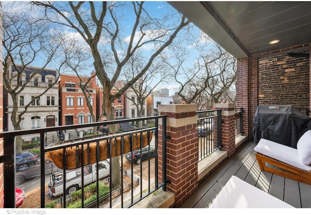 balcony featuring area for grilling