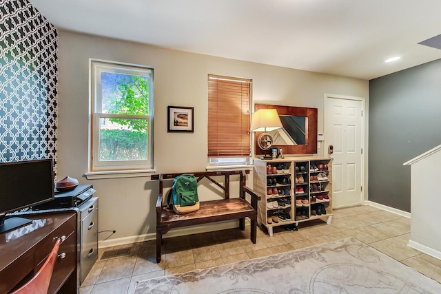 interior space with recessed lighting, visible vents, baseboards, and tile patterned flooring