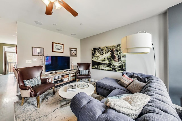 living area with a ceiling fan