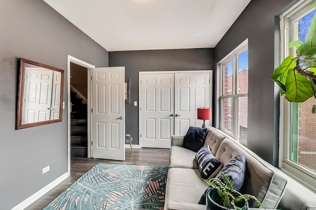 living room with dark wood-style floors and baseboards