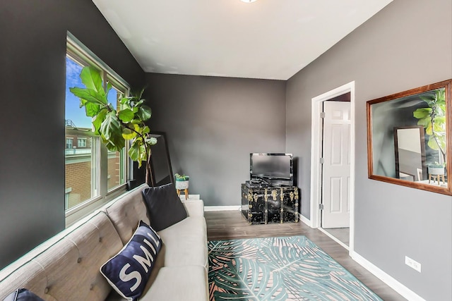 sitting room featuring wood finished floors and baseboards