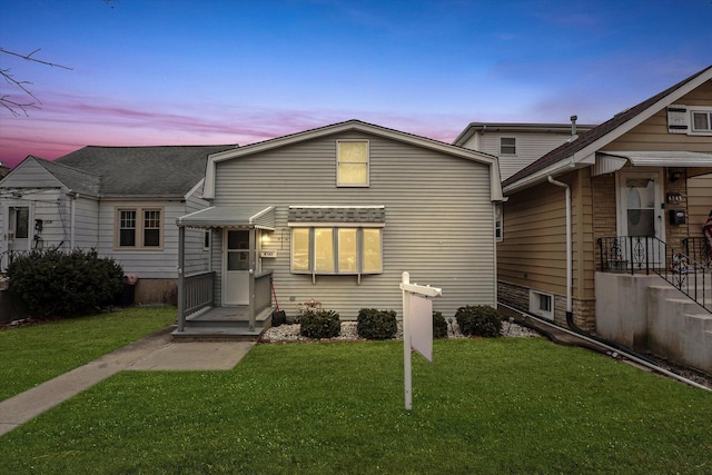 view of front of home with a lawn