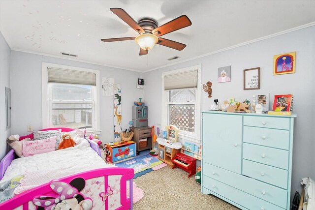 carpeted bedroom with visible vents, ceiling fan, and crown molding