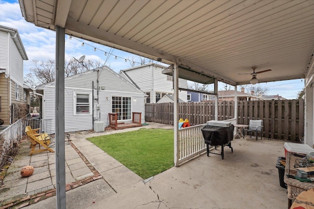 view of patio with grilling area, fence private yard, and a ceiling fan