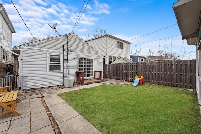 back of property featuring a patio area, a yard, fence, and cooling unit