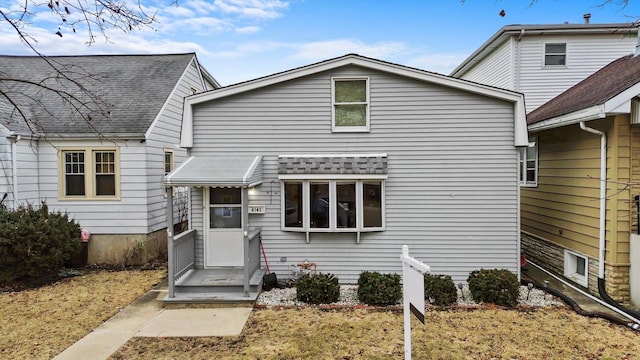 view of front of home featuring roof with shingles