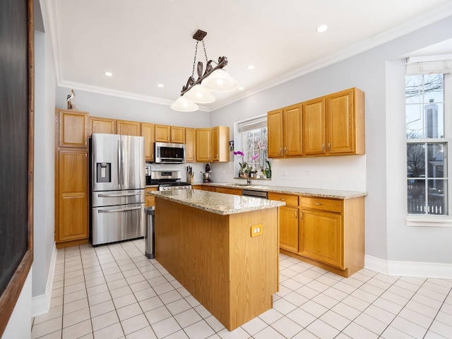 kitchen with light tile patterned floors, light stone counters, stainless steel appliances, a kitchen island, and crown molding