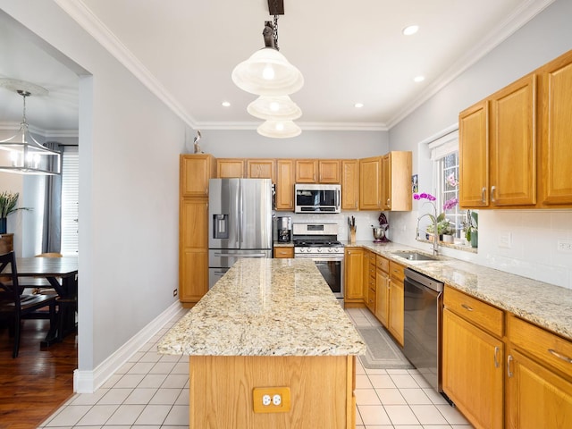 kitchen with appliances with stainless steel finishes, backsplash, a kitchen island, and a sink