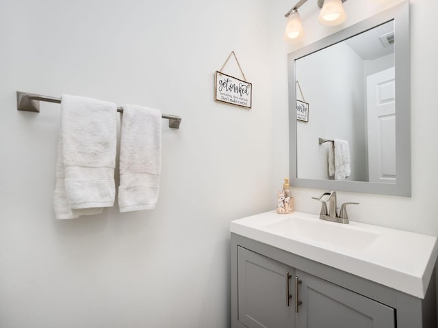 bathroom featuring vanity and visible vents