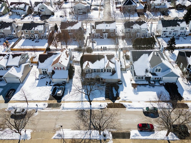 snowy aerial view featuring a residential view