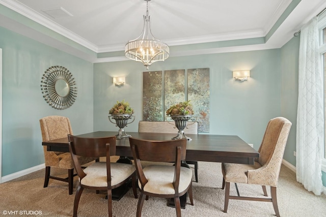 dining area with crown molding, a raised ceiling, light carpet, baseboards, and an inviting chandelier