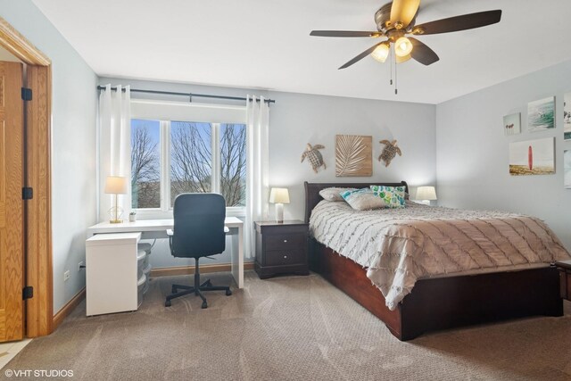 bedroom with baseboards, a ceiling fan, and carpet