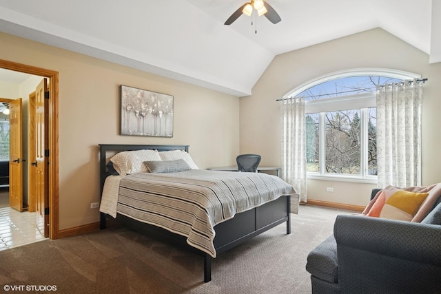 bedroom featuring carpet floors, baseboards, and vaulted ceiling