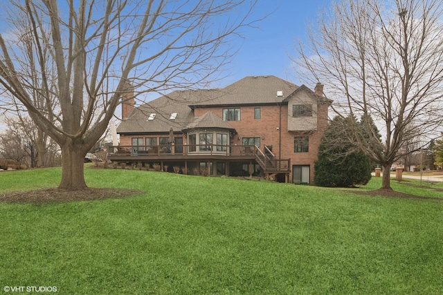 rear view of house with a wooden deck, stairs, a yard, and a chimney