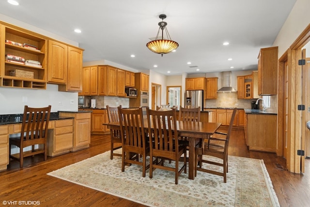 dining room with dark wood-style floors and recessed lighting