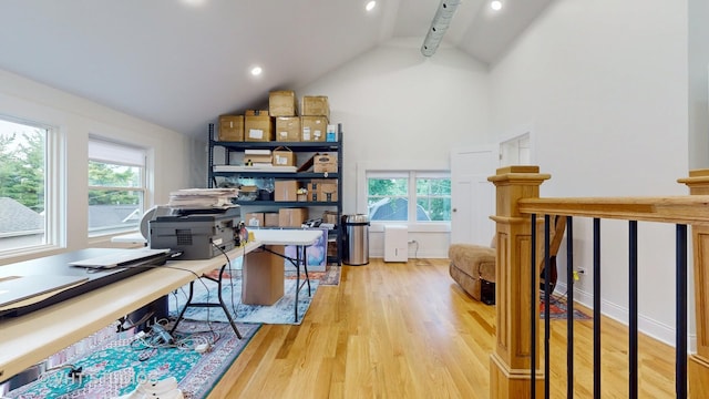 office space with high vaulted ceiling, recessed lighting, baseboards, and wood finished floors