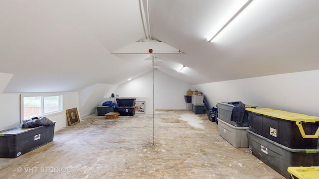 additional living space featuring vaulted ceiling