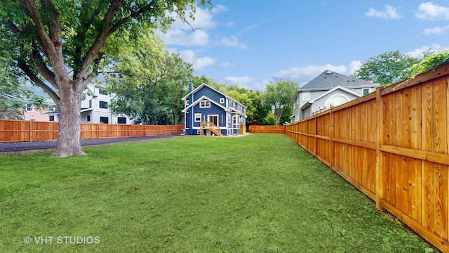 view of yard with a fenced backyard