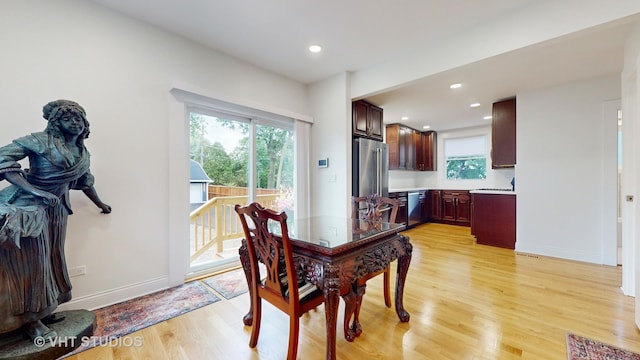 dining area with baseboards, recessed lighting, and light wood-style floors