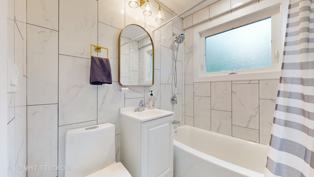 full bath featuring toilet, shower / bath combo, tile walls, and vanity