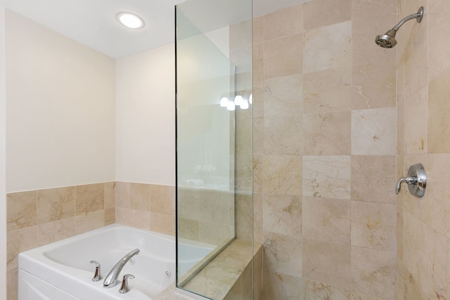 full bath featuring a tile shower and a bath