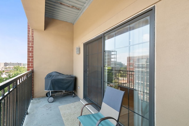 balcony with a grill and a city view